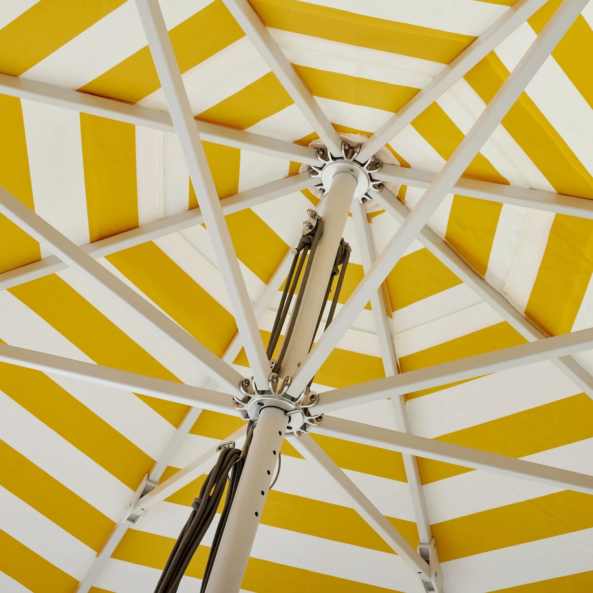 Premium Caspar Patio Umbrella offering extensive shade, UPF50+ sun protection, and a minimalist stripe design for outdoor decor.