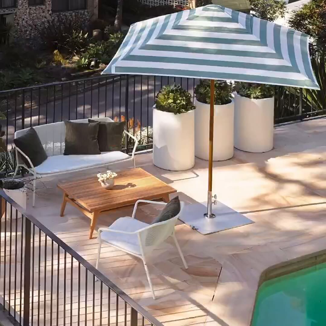 Sundial+ Umbrella by Basil Bangs with timber-look aluminum frame, 2m canopy, and eco-friendly, scratch-resistant finish.